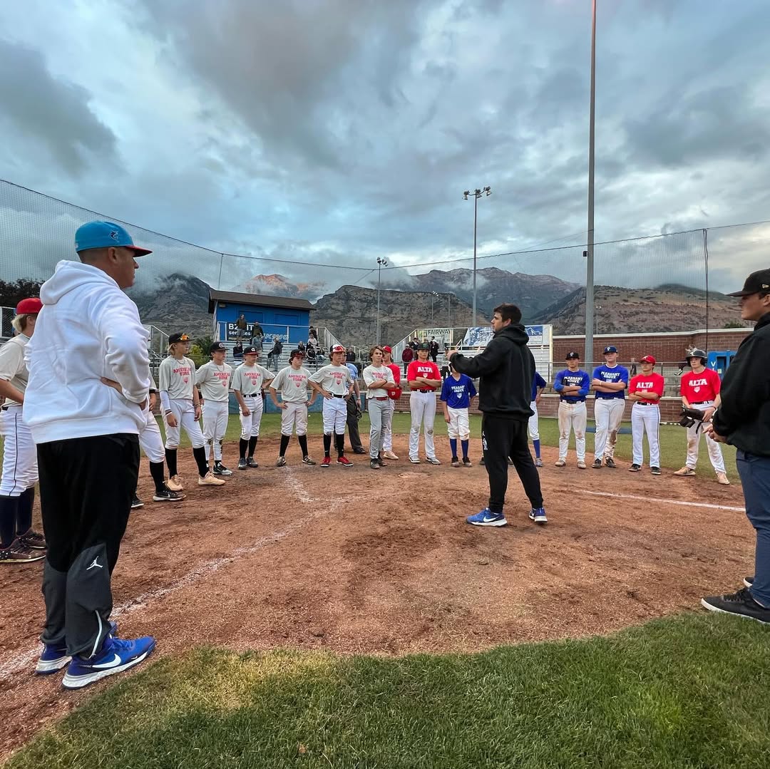 Diamond Respect founder talking to players at home plate.